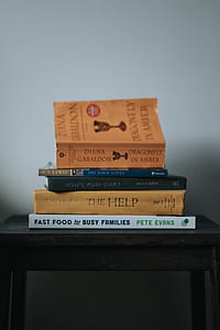 assorted books on table thumbnail