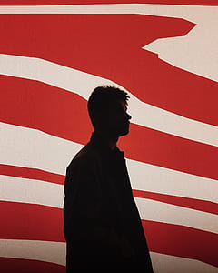 silhouette photo of man with red background thumbnail