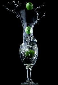 clear wine glass with three green limes thumbnail