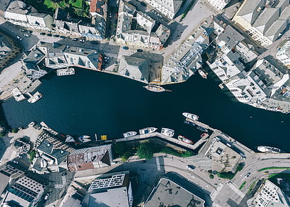bird's-eye view photography pf body of water and buildings thumbnail