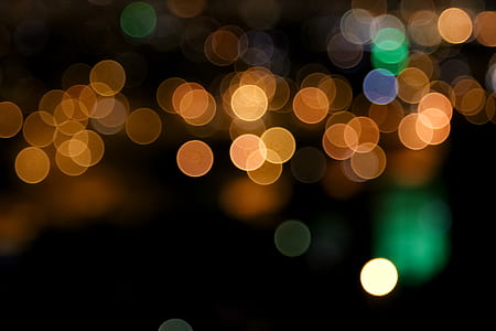 bokeh photography of orange and green lights thumbnail