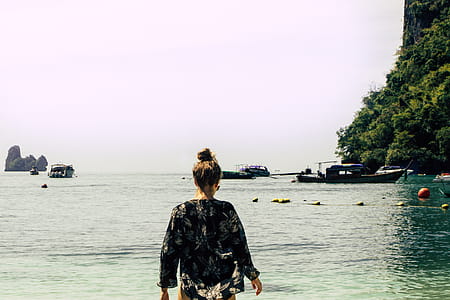 Woman Wearing Black and White Floral Top in the Beach thumbnail