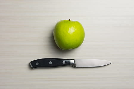 Green Apple Beside Silver Bladed Knife thumbnail