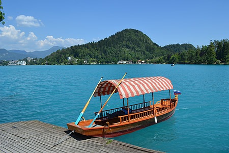 brown boat on body of water thumbnail