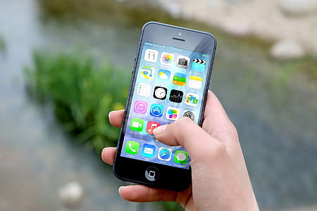 person holding black iPhone 5 thumbnail