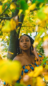 woman leaning against tree thumbnail