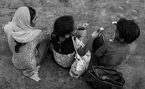 girls and boy sits on ground thumbnail