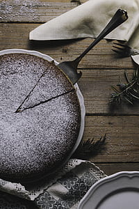 cake server over chocolate cake on table thumbnail