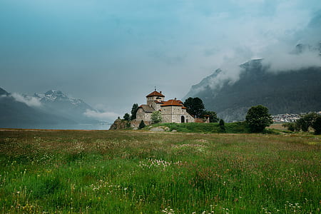 gray and red house with field thumbnail