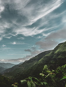 green mountain landscape during semi cloudy daytime thumbnail