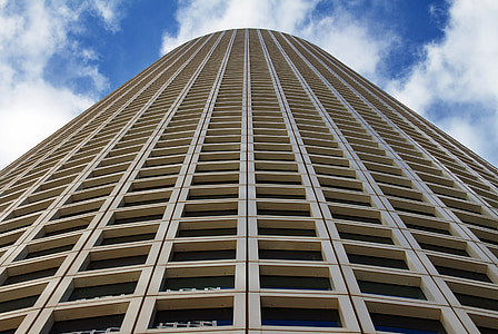 low angle photography of beige concrete building thumbnail