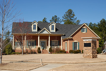 black and brown concrete house during daytime thumbnail