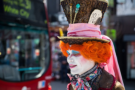 An eccentric gentleman, otherwise known as a weirdo in a silly hat, is captured on Camden High Street in London, England thumbnail
