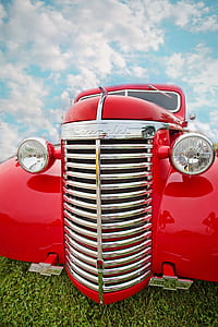 close up photograph of red car thumbnail