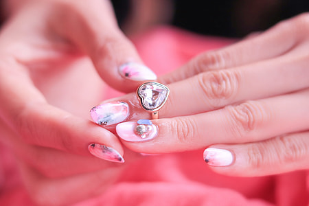 woman with pink nail artworks manicure thumbnail