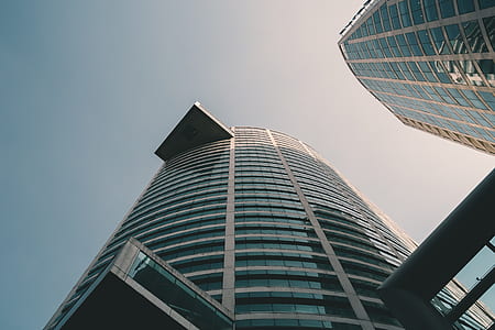 low-angle photography of blue and white high-rise building thumbnail