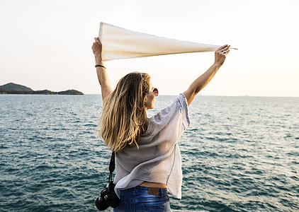 woman raising white pennant flag thumbnail