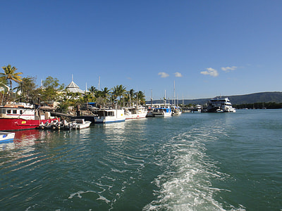 docked boats on body of water thumbnail
