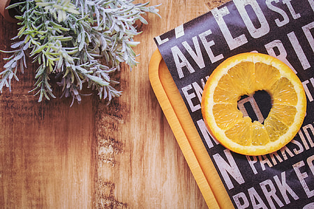sliced of lemon on brown wooden tray thumbnail