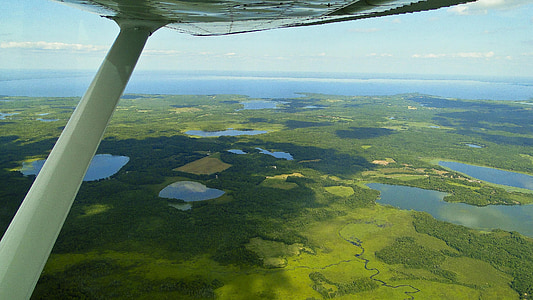 aerial photography of water and landscape thumbnail