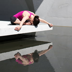 woman in purple top performing yoga thumbnail