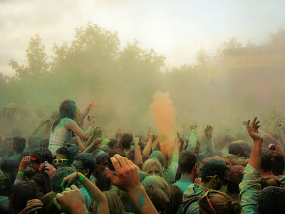 people gathering outside playing with color powders thumbnail