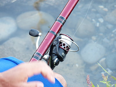 red fishing rod with reel thumbnail