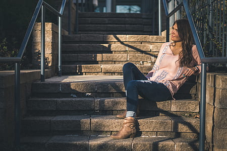 woman sitting on concrete stairs thumbnail