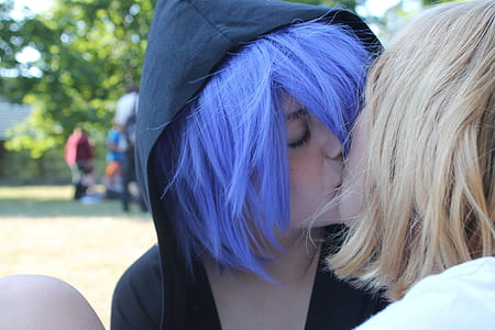 two female cosplayer kissing wearing black hoodie thumbnail