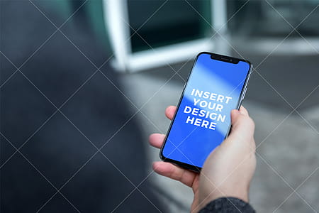 Man use his iPhone X on the street. PSD Mockup thumbnail