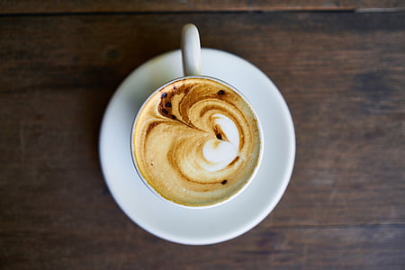coffee with heart decor on white saucer thumbnail
