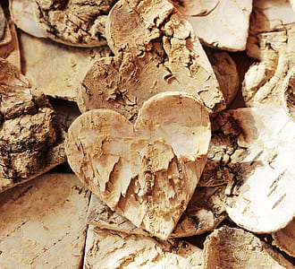 two brown wooden heart decors thumbnail