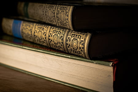 three hardbound books thumbnail