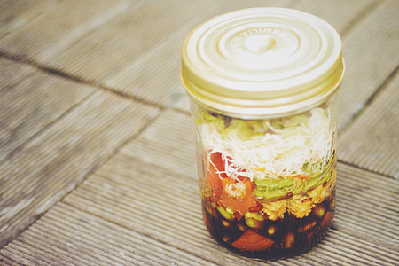 vegetable dish in bottle on brown surface thumbnail