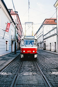 photo of red and white train during daytime thumbnail