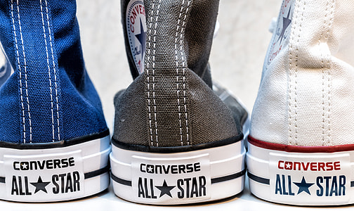 three unpaired Converse All Star sneakers thumbnail