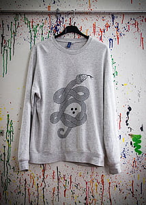 gray sweatshirt hanging on wall thumbnail