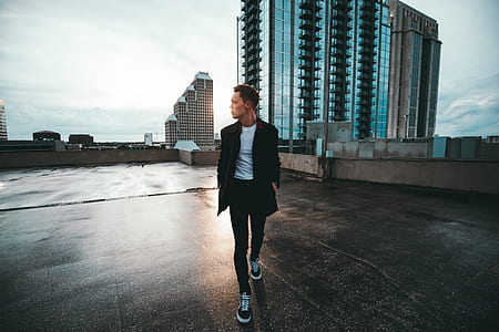 man walking on rooftop at daytime thumbnail