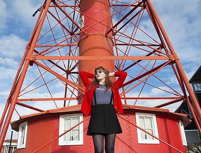 woman standing beside the tower thumbnail