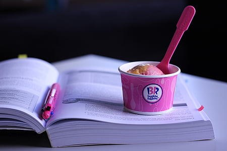pink plastic cup on book thumbnail