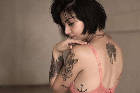 woman wearing pink lace brassiere thumbnail