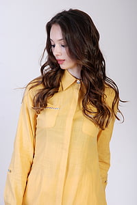 woman wearing yellow button-up sirt thumbnail