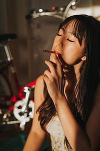 woman smoking red cigarette thumbnail