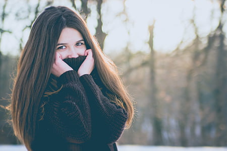 woman in black sweater photo thumbnail