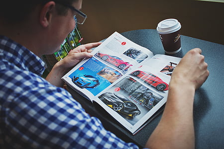 man reading magazine thumbnail