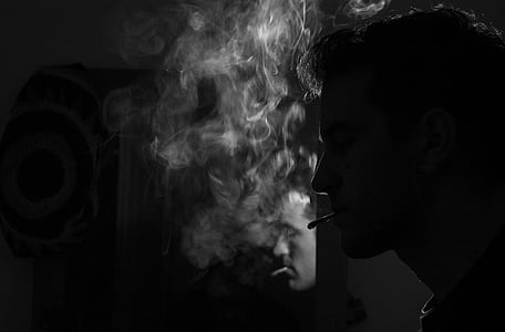photo of man smoking cigarette thumbnail