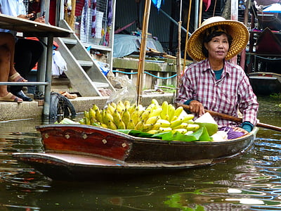 woman riding boat with bananas thumbnail