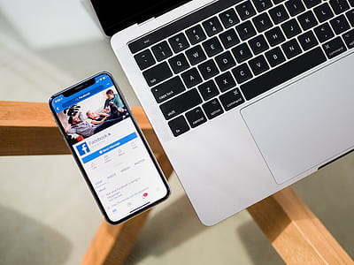 silver iPhone X beside MacBook PRO thumbnail