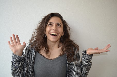 woman wearing open cardigan near wall thumbnail