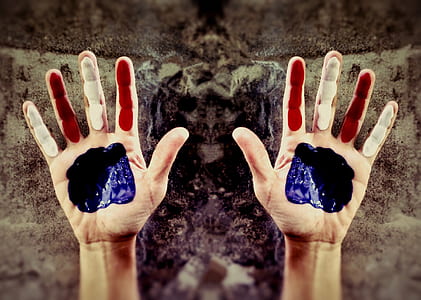minimalist photography of hands with paints thumbnail